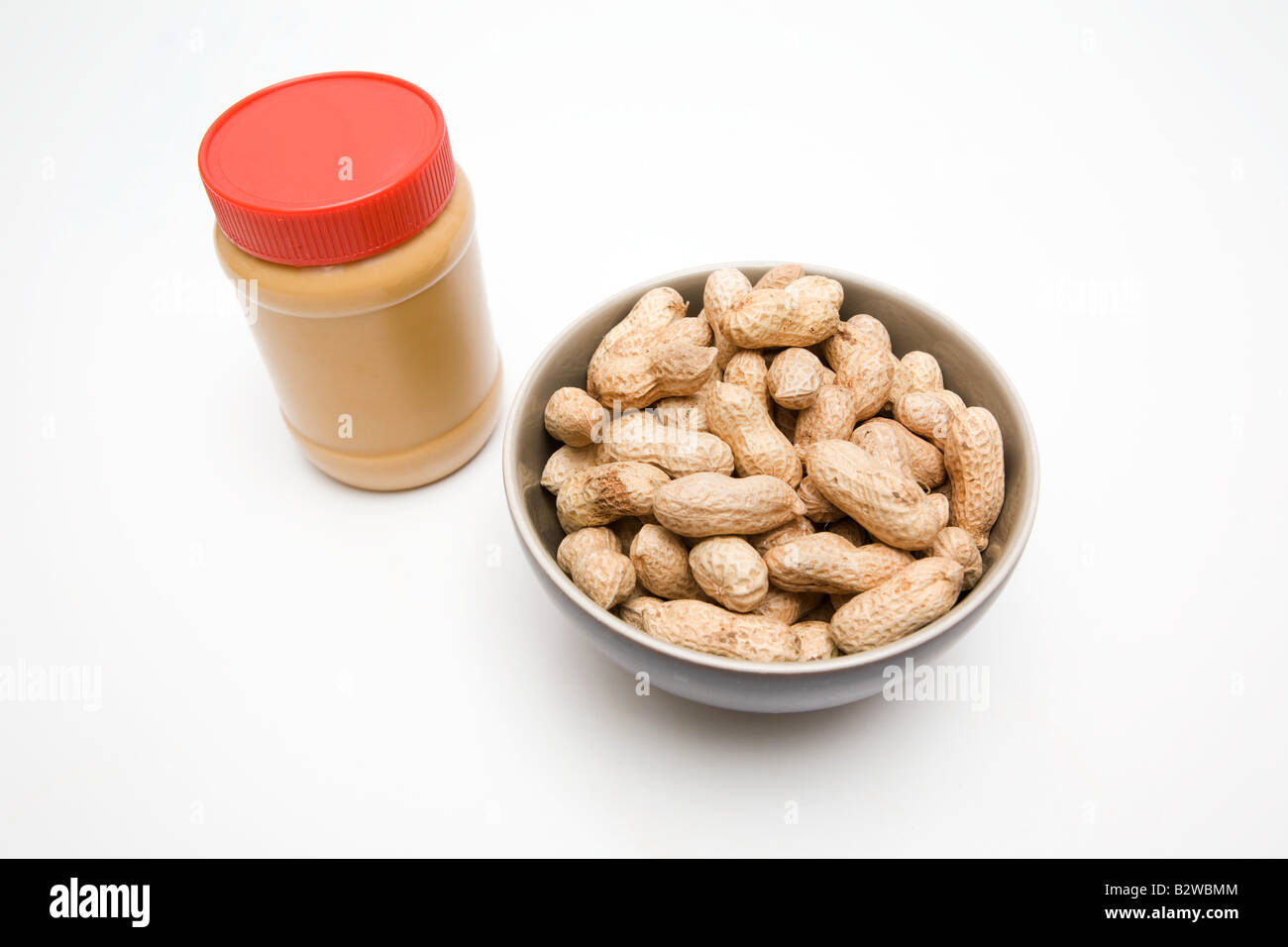 A jar of peanut butter and peanuts Stock Photo Alamy