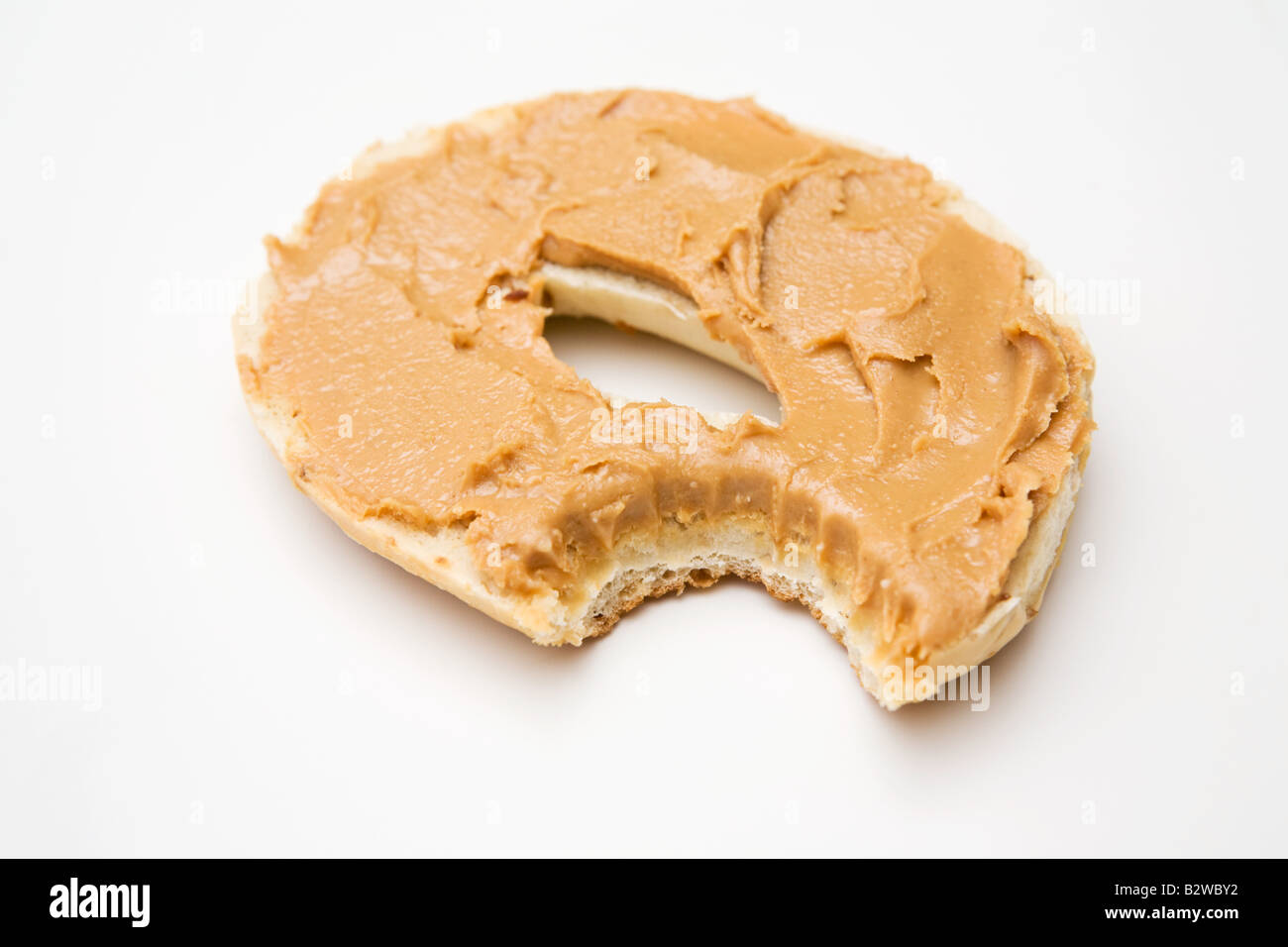 A bagel with a missing bite Stock Photo