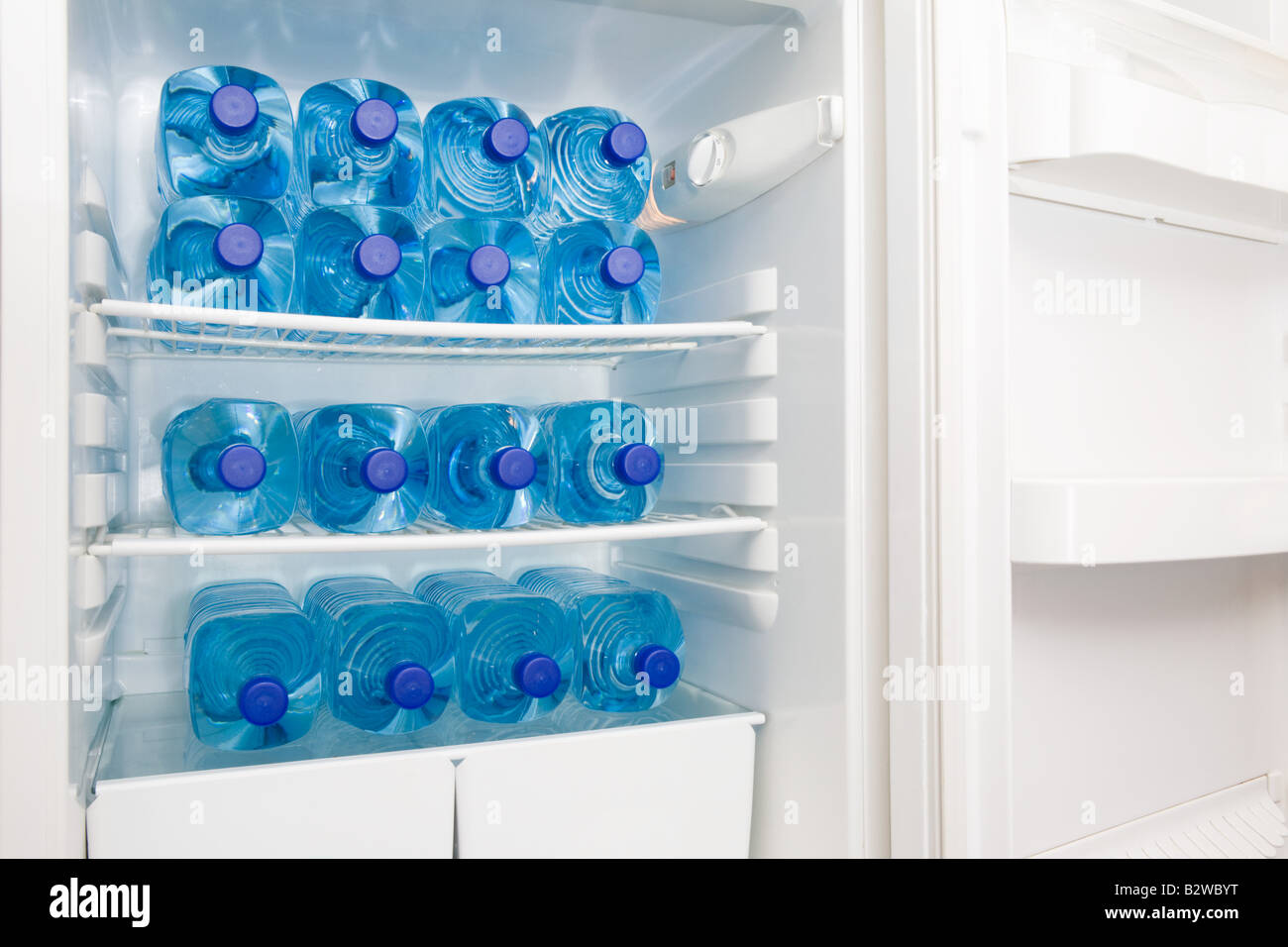 Bottles of water in a fridge Stock Photo