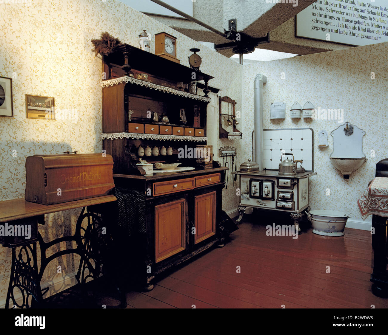 D-Essen, Ruhr area, North Rhine-Westphalia, Cultural Capital 2010, Ruhrland Museum, interior view, exhibition, historic kitchen, kitchen appliance, sewing machine, cabinet, cupboard, kitchen cabinet, kitchen cupboard, oven, stove, cooker, masonry heater, Stock Photo