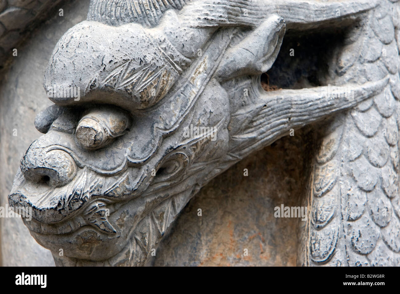 Carved stone dragon But Thap Pagoda near Hanoi Vietnam Stock Photo