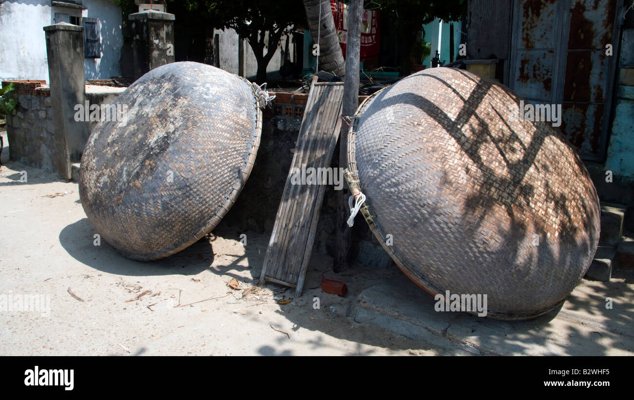 Traditional circular woven coracle boats Cham Island off historic Hoi An Vietnam Stock Photo