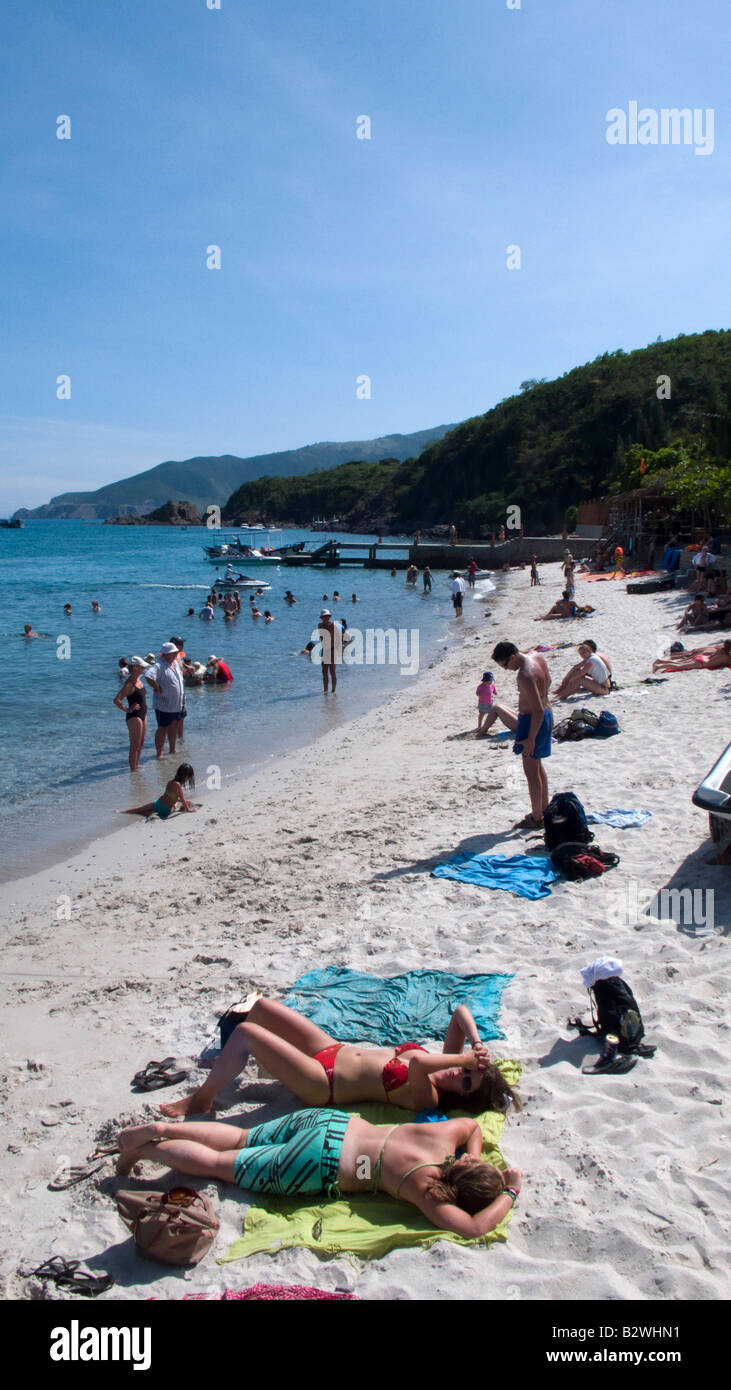 Popular island party cruise Number 4 stops at sandy beach Tam Island off Nha Trang Vietnam Stock Photo