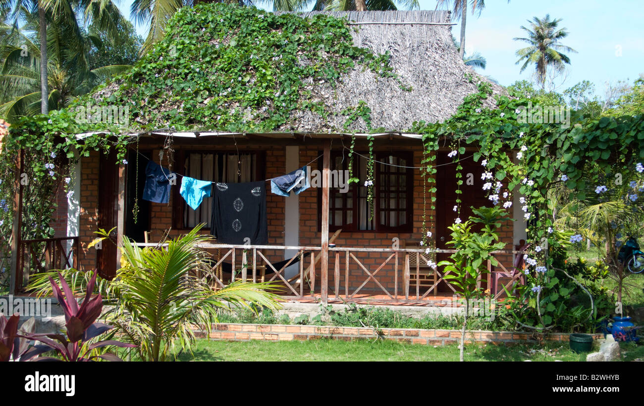 Tropical palm thatch bungalows Thanh Kieu Coco Beach Phu Quoc Island Vietnam Stock Photo