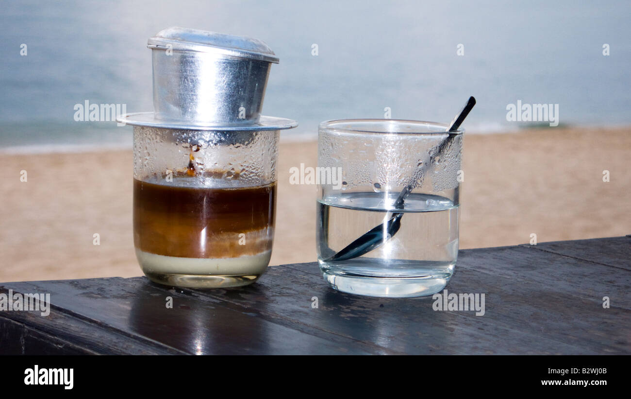 Vietnamese filter coffee made individually in glass with condensed milk Phu Quoc Island Vietnam Stock Photo