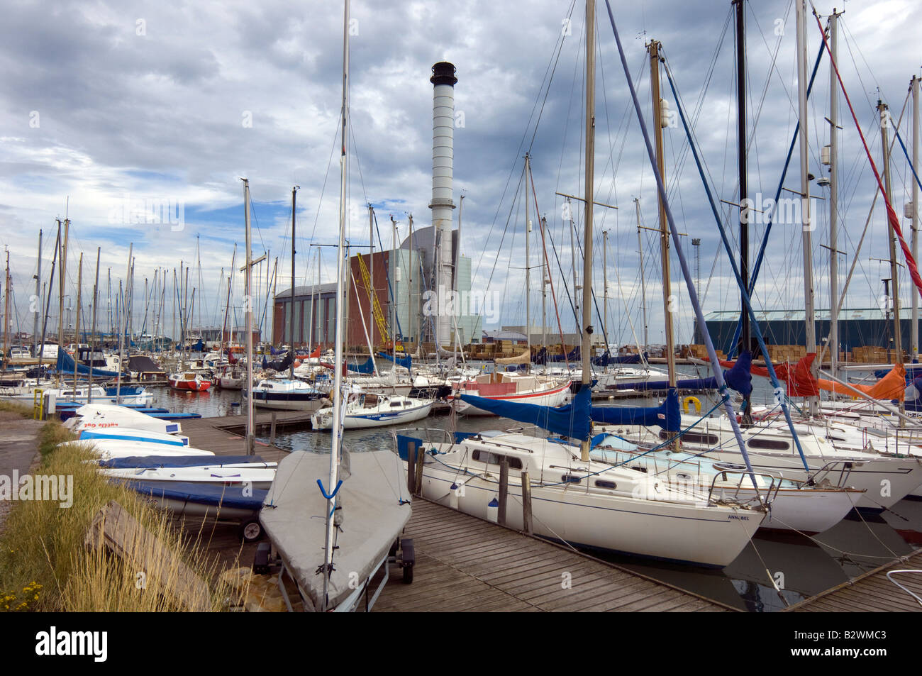 Shoreham Power Station seen through a marina of small yachts in Shoreham Harbour West Sussex Stock Photo