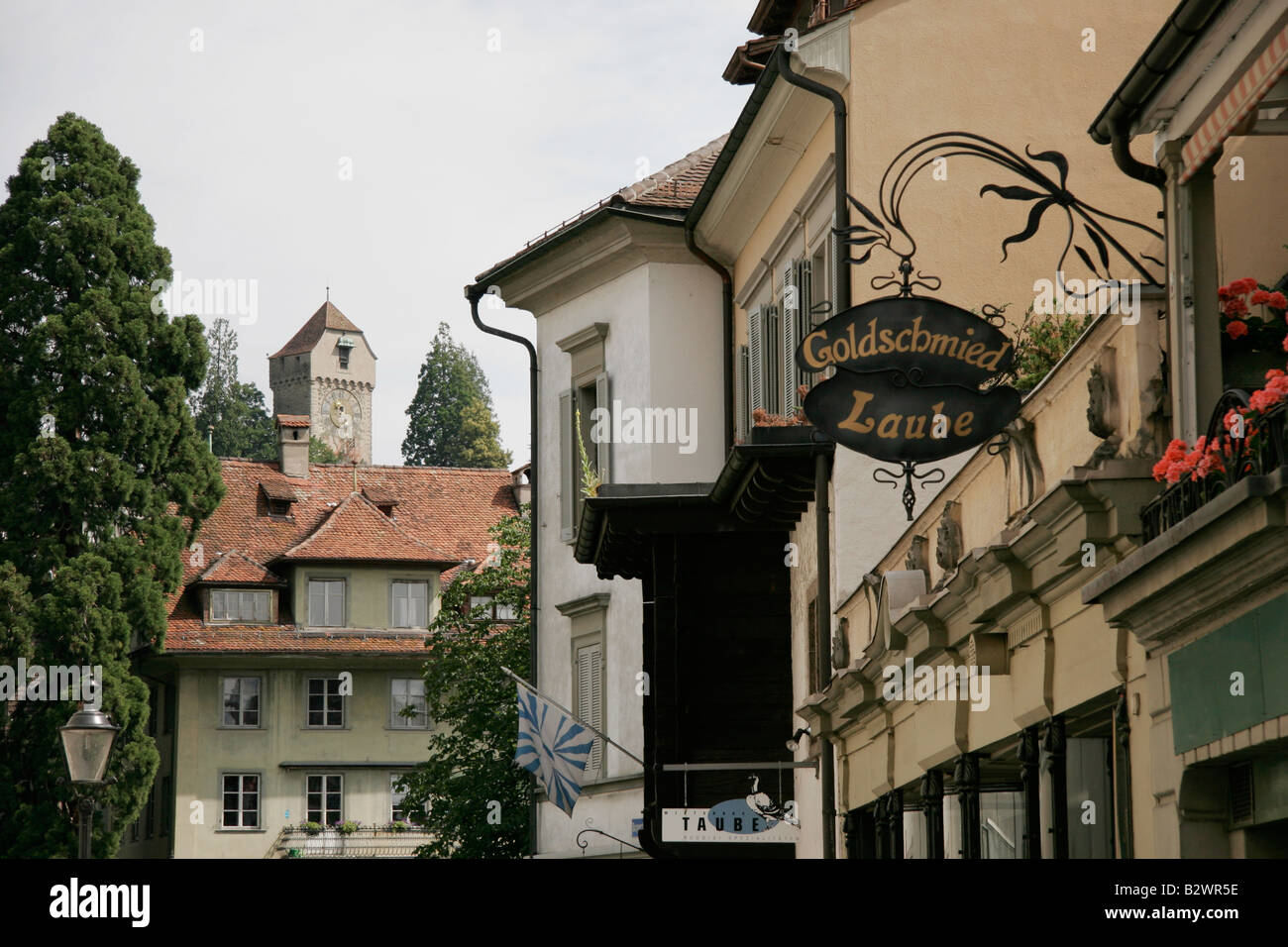 Zyt tower of the Rampart Wall seen on the horizon of a traditional Swiss street in old Lucerne, Central Switzerland Stock Photo