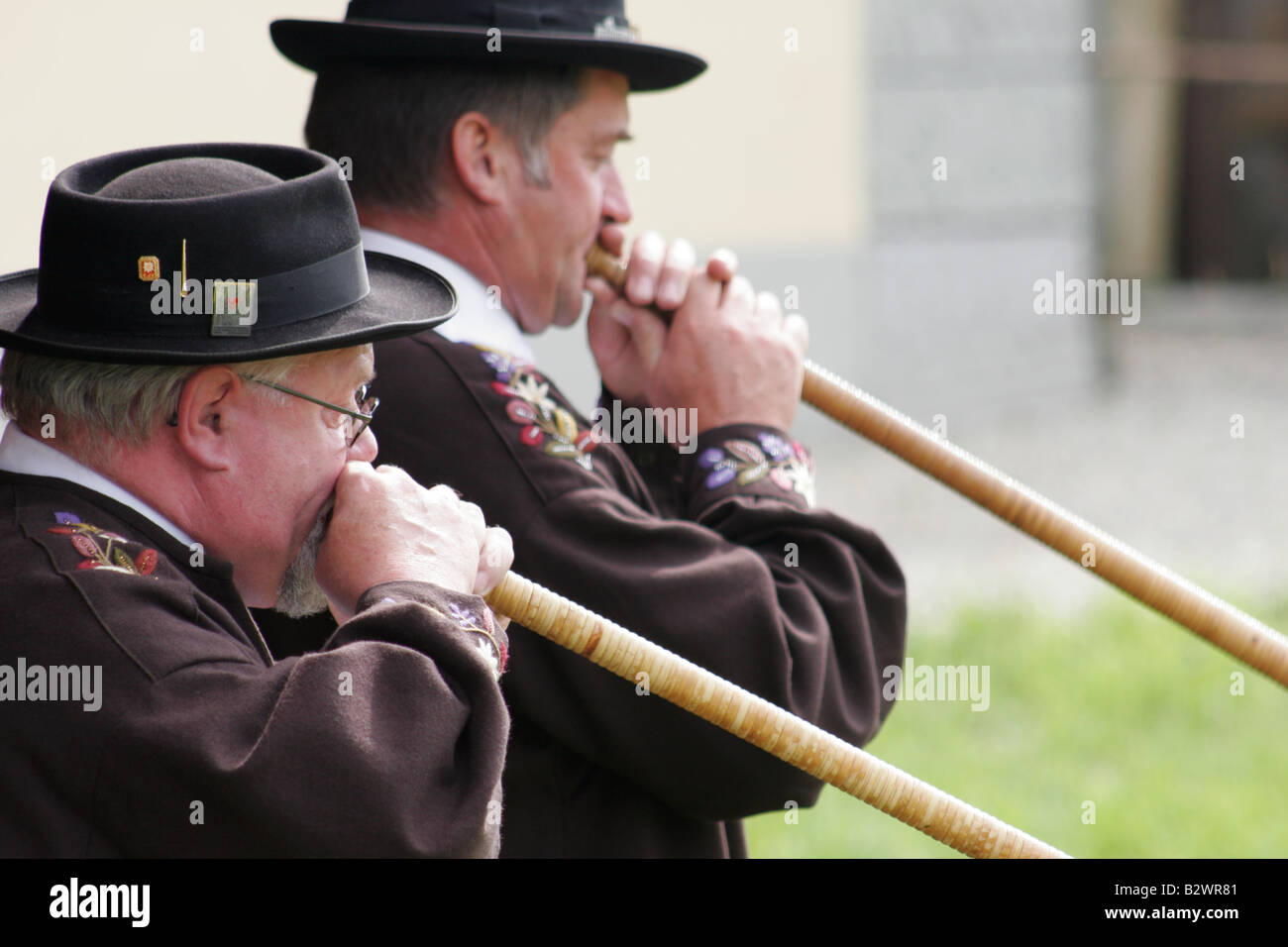 Alphorn players in traditional costume during Jodlerfest in Malters, near Lucerne, Central Switzerland Stock Photo