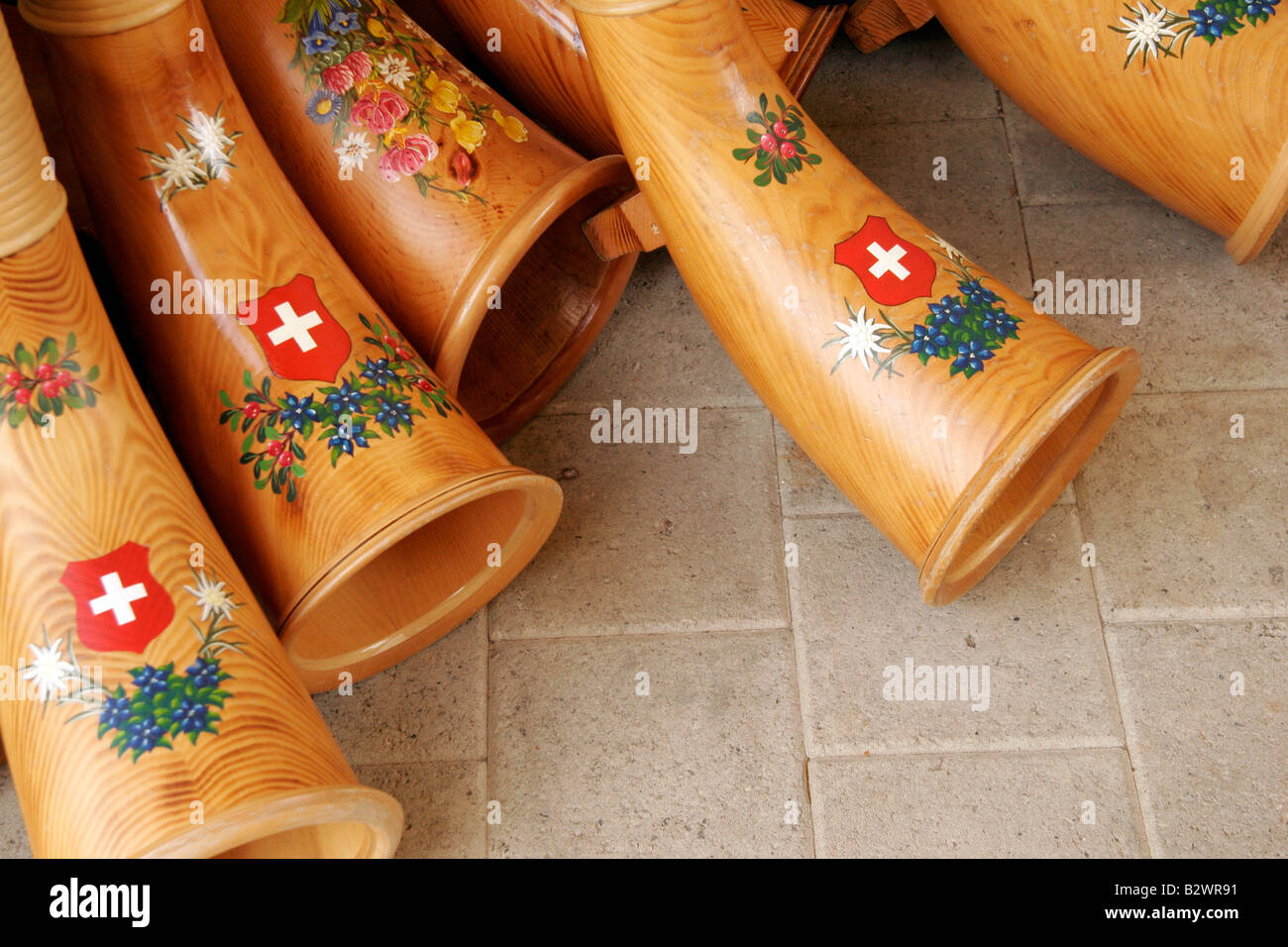 Alphorns with traditional swiss flag and flower decorations painted, Jodlerfest in Malters, near Lucerne, Central Switzerland Stock Photo