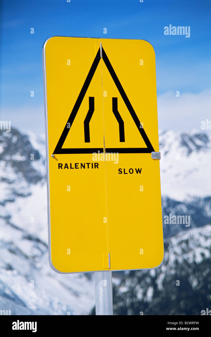 Slow sign on snowy mountain (selective focus Stock Photo Alamy