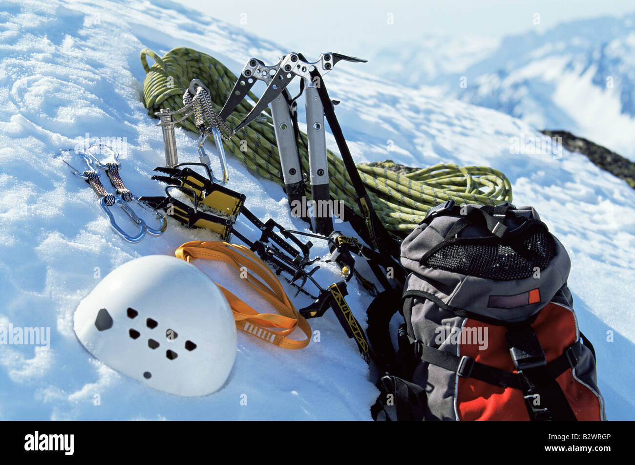 Mountain climbing equipment on a snowy mountain (selective focus) Stock Photo
