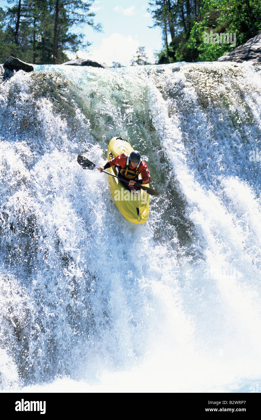 Kayaker in rapids going over waterfall Stock Photo Alamy