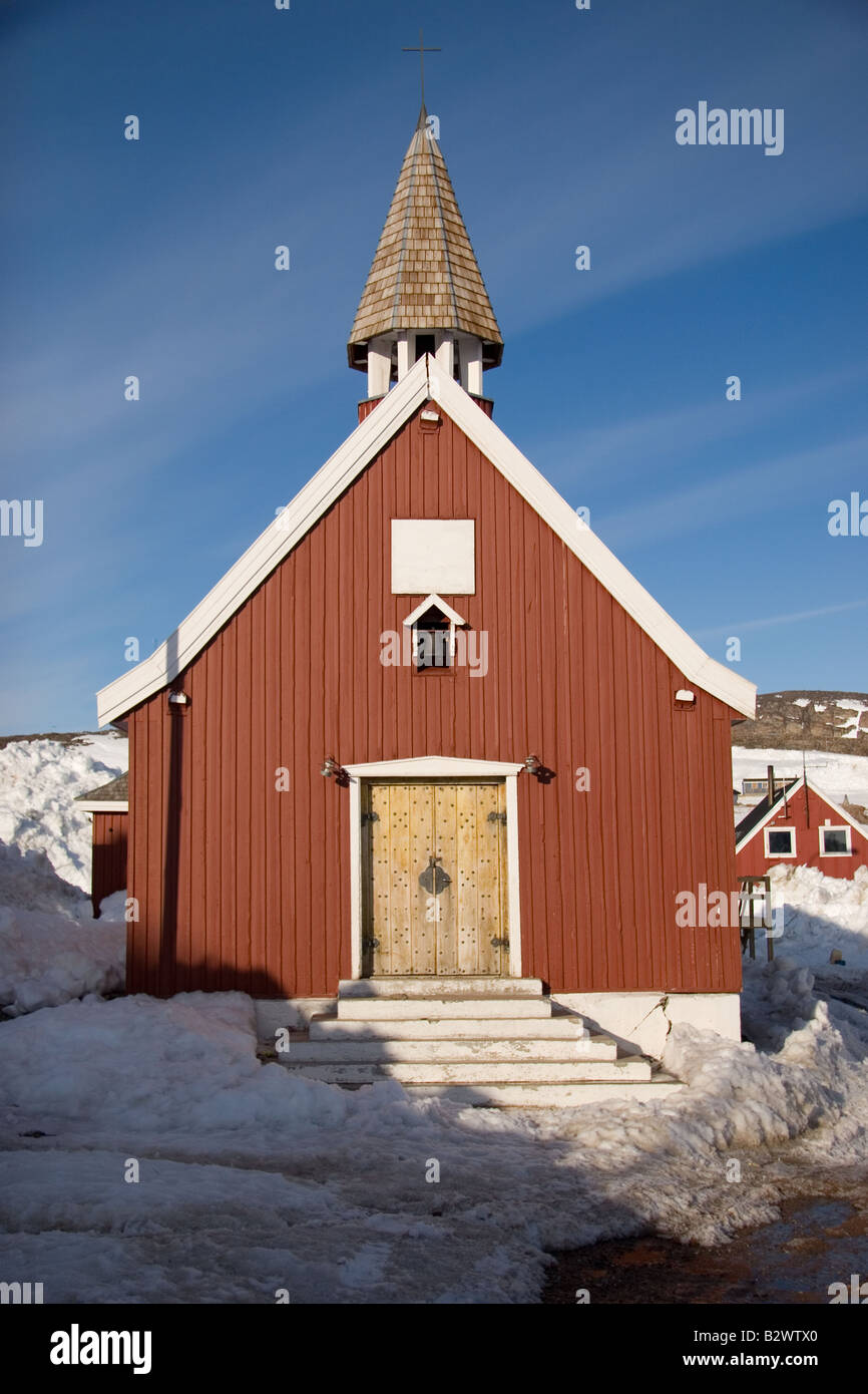 The traditional little red-painted wooden church in the village of Ittoqqortoormiit, Scoresbysund, East Greenland Stock Photo