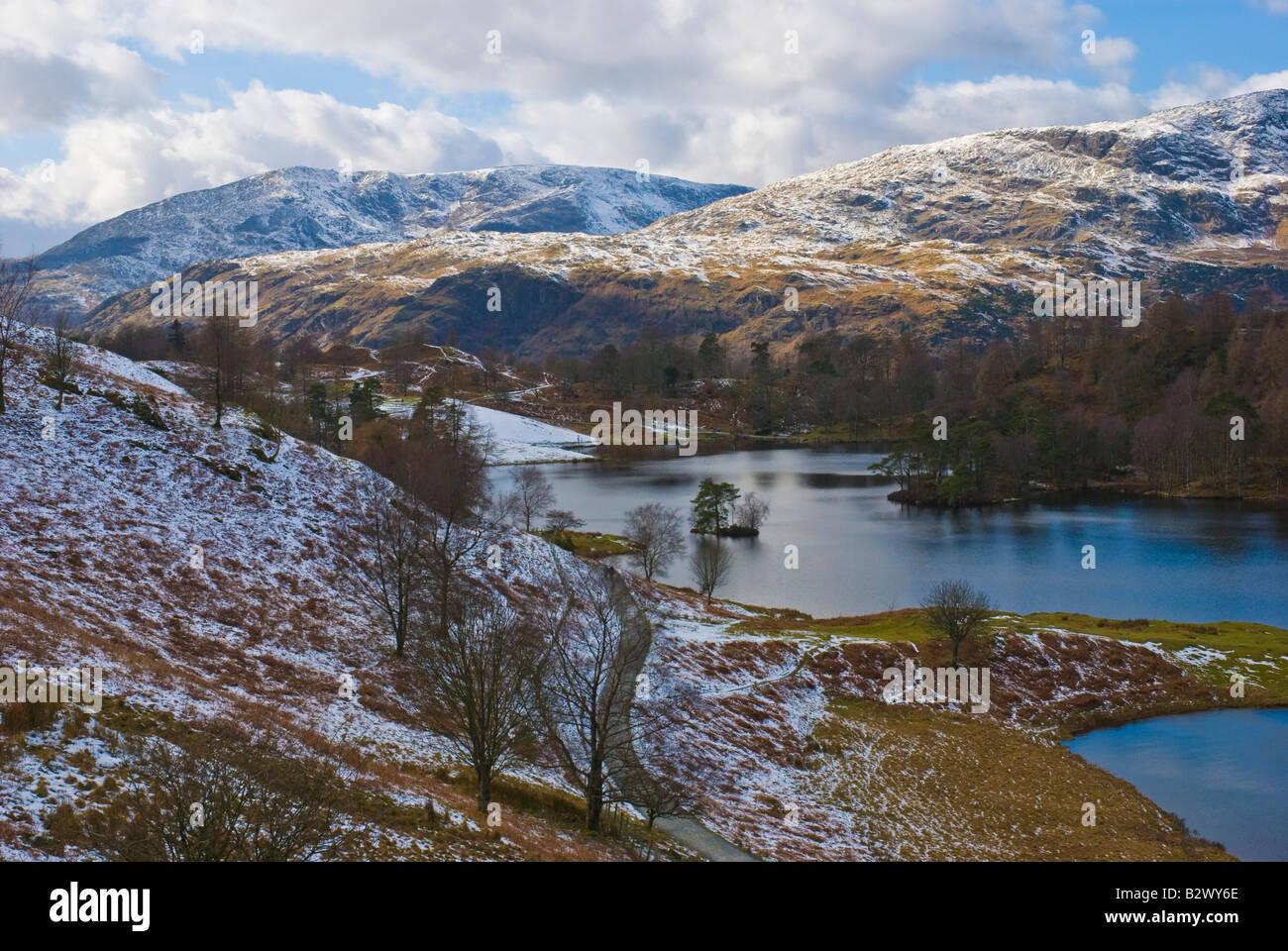 Tarn Hows with Coniston Old Man and Wetherlam in background Stock Photo