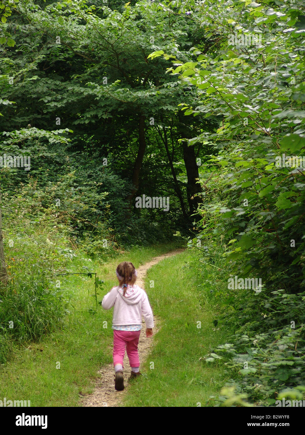 A little girl walking on trail path near Bridlington Stock Photo - Alamy