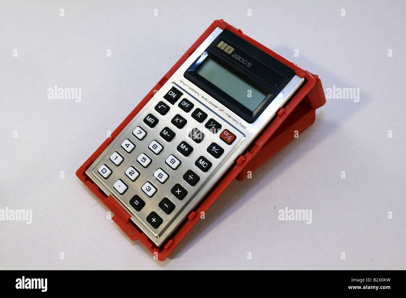 HD 2200 S pocket LCD calculator with red flip back case which doubles as a  stand on white background Stock Photo - Alamy