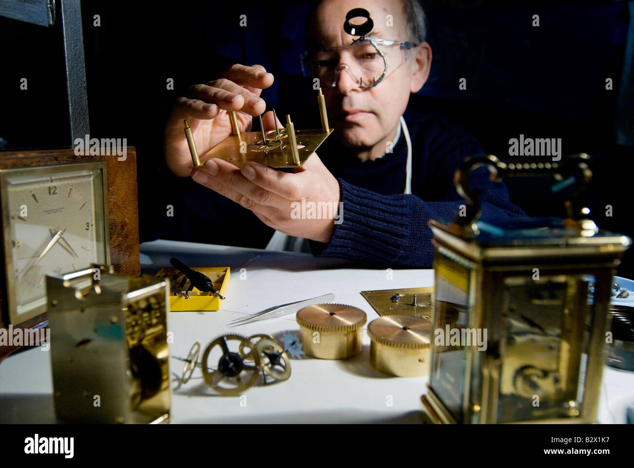 Man repairing clocks Stock Photo Alamy