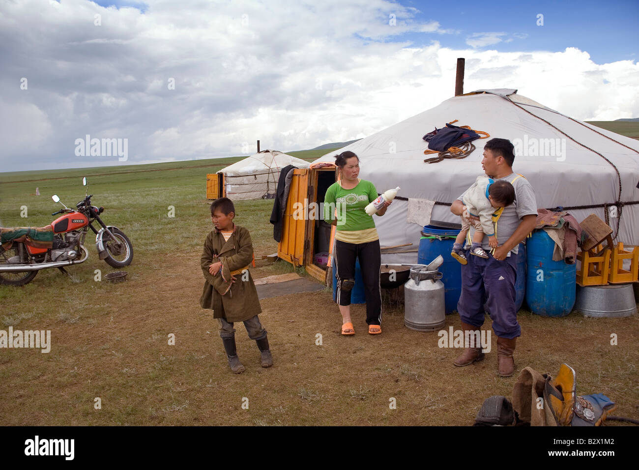 Herding family in front of their ger, a felt nomadic tent Stock Photo