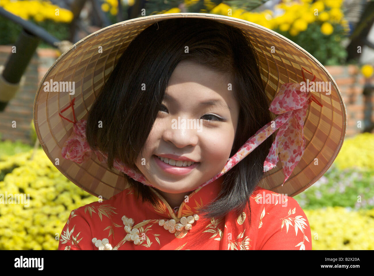 Portrait young girl dressed for Tet Festival Nguyen Hue Saigon Vietnam Stock Photo