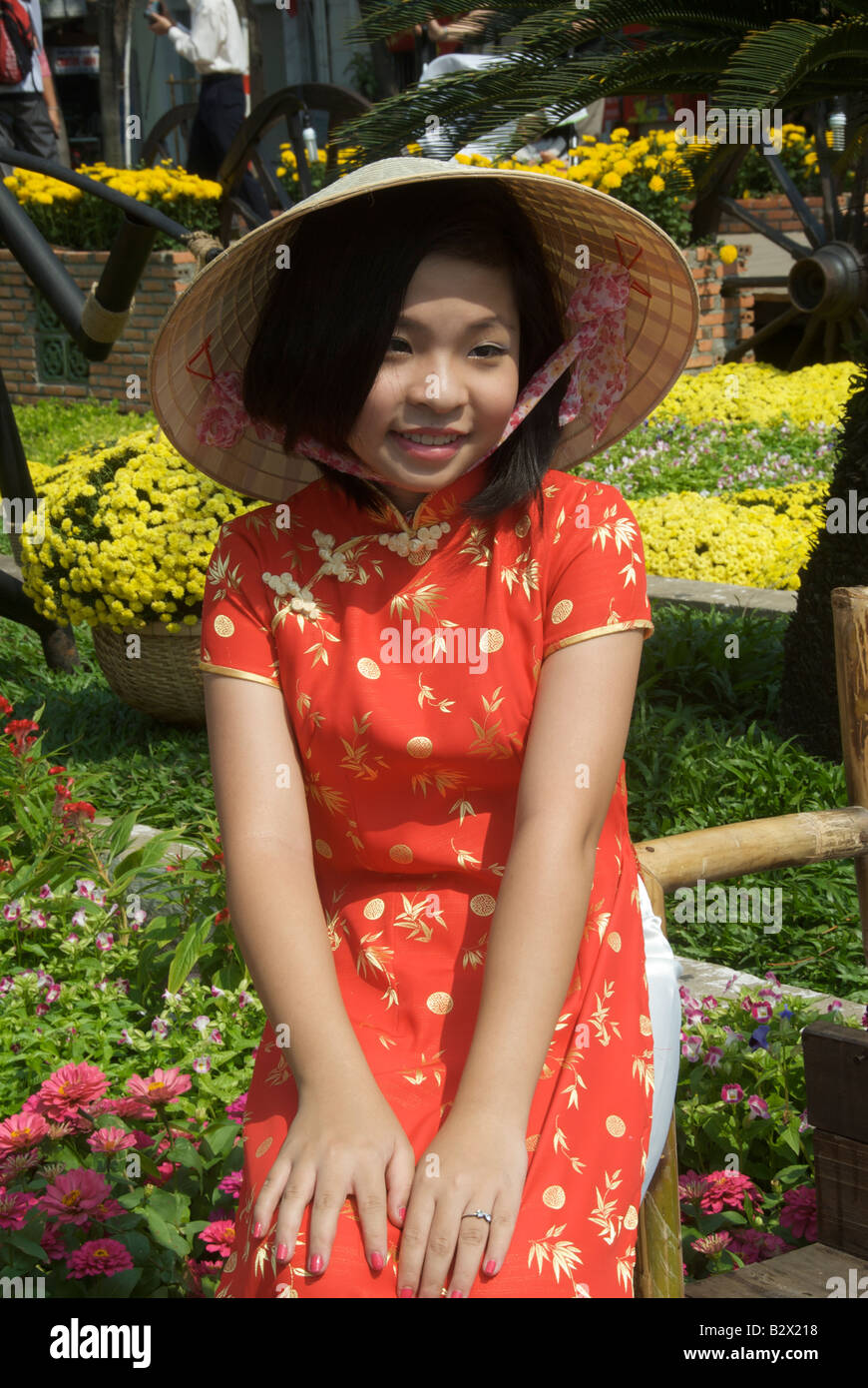 Pretty girl dressed for Tet Festival Nguyen Hue Saigon Vietnam Stock Photo