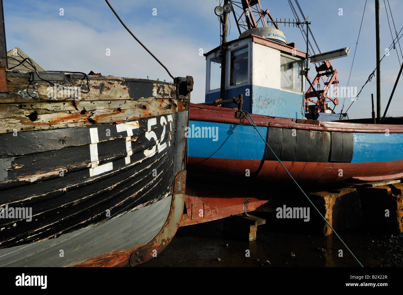 Old Fishing Boats on the banks of the River Blythe, Blackshore Southwold Stock Photo