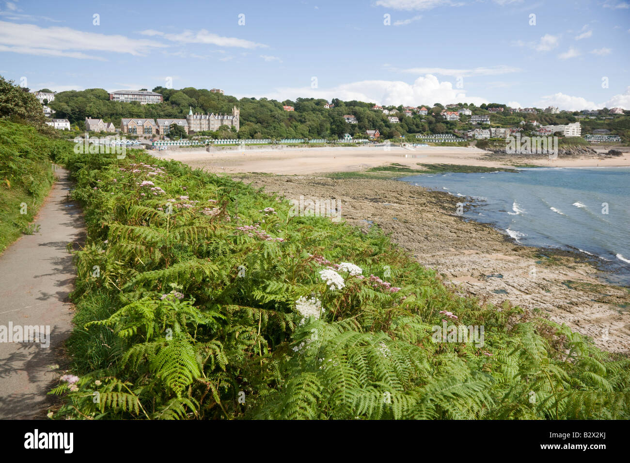 View along the coast path towards Langland Bay in the Gower Wales Stock Photo