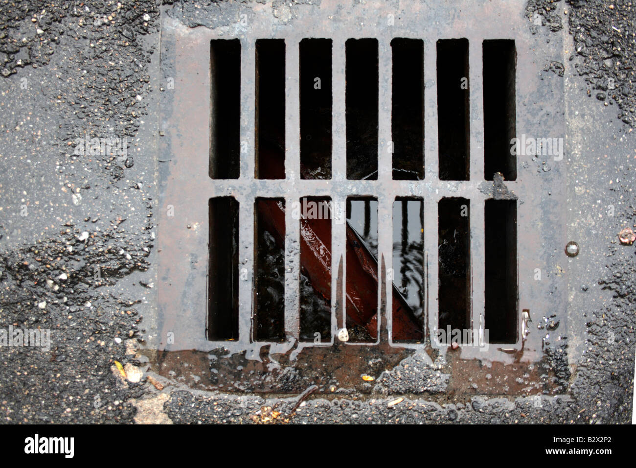 Drainage grating on street. Stock Photo