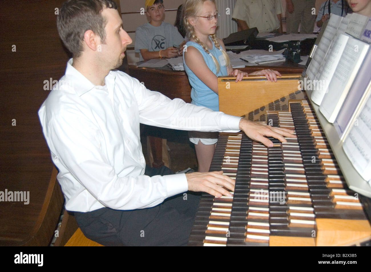 A man playing a pipe organ, All Souls Unitarian Church Washington D.C