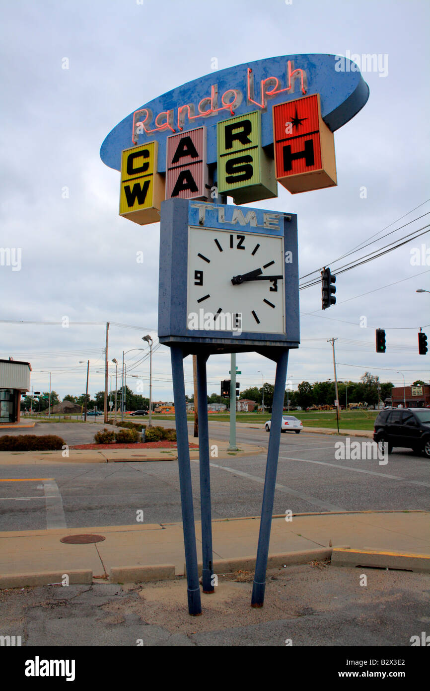 Colorful vintage vertical rotating business sign with stationary dial