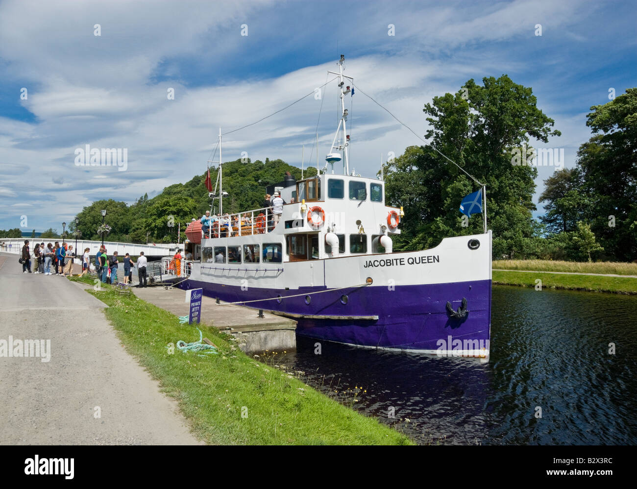 Cruise vessel Jacobite Queen moored on the Caledonian Canal in Inverness taking on passengers for a cruise on Loch Ness Stock Photo