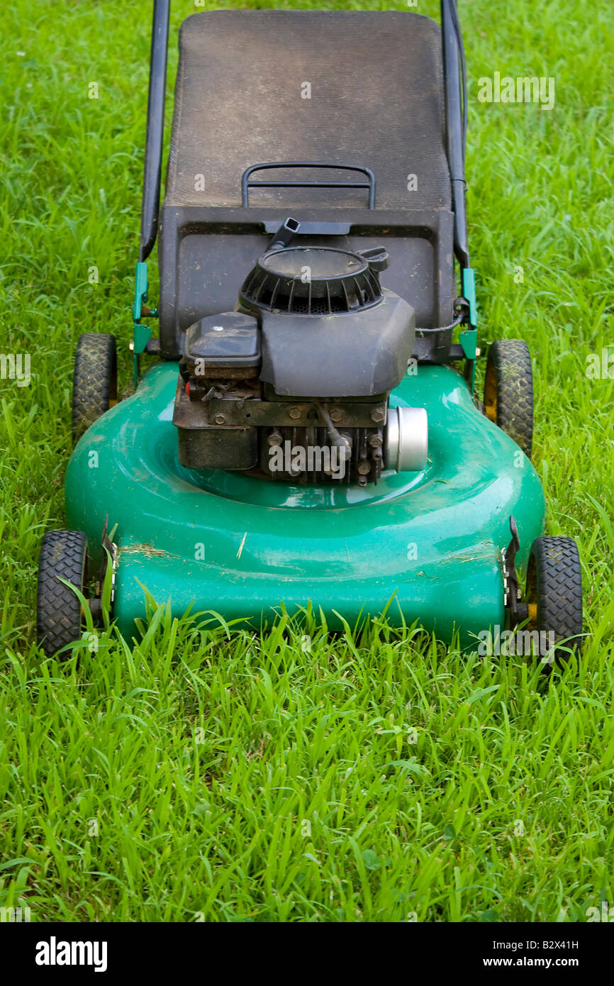 A modern lawn mower cutting through the grass Stock Photo Alamy