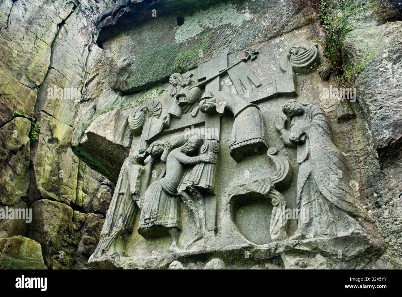 The Descent from the Cross Christian mediaeval relief on natural stone pillars at Externsteine. Teutoburger Wald region, Germany Stock Photo