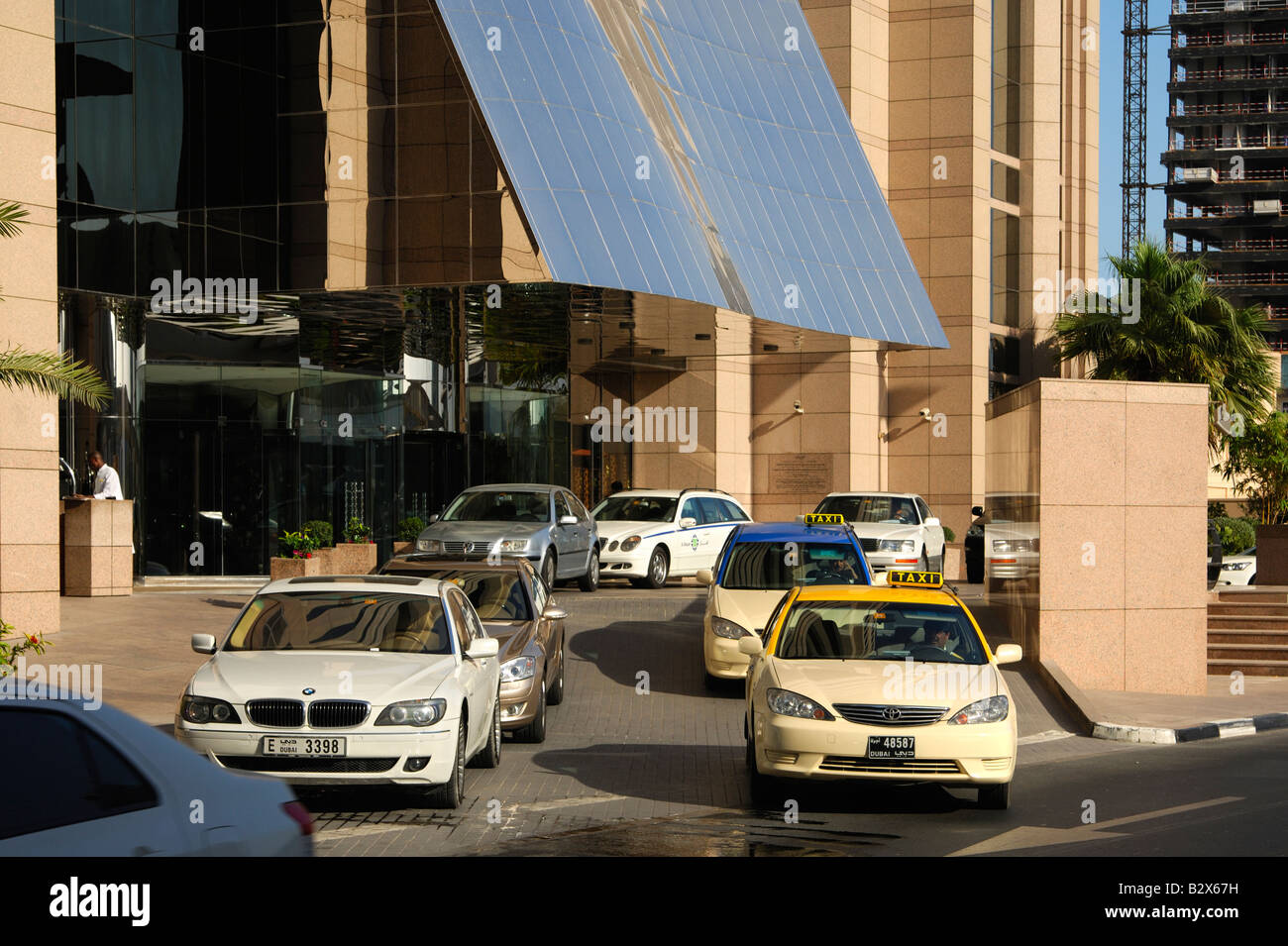 Taxis and cars on the drive of the Fairmont Tower hotel, Sheikh Zayed