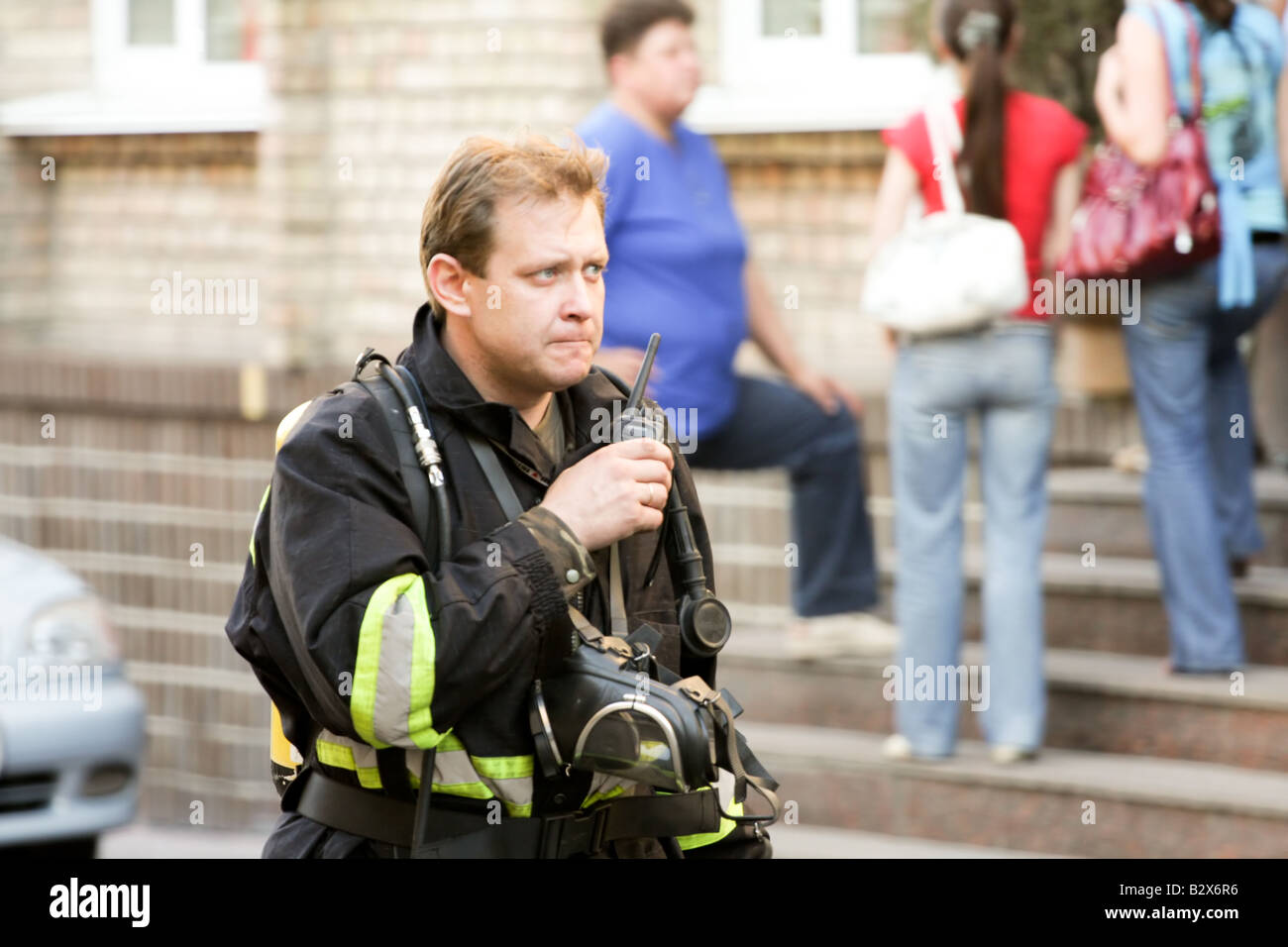 Firefighter at work, talking on a radio Stock Photo Alamy