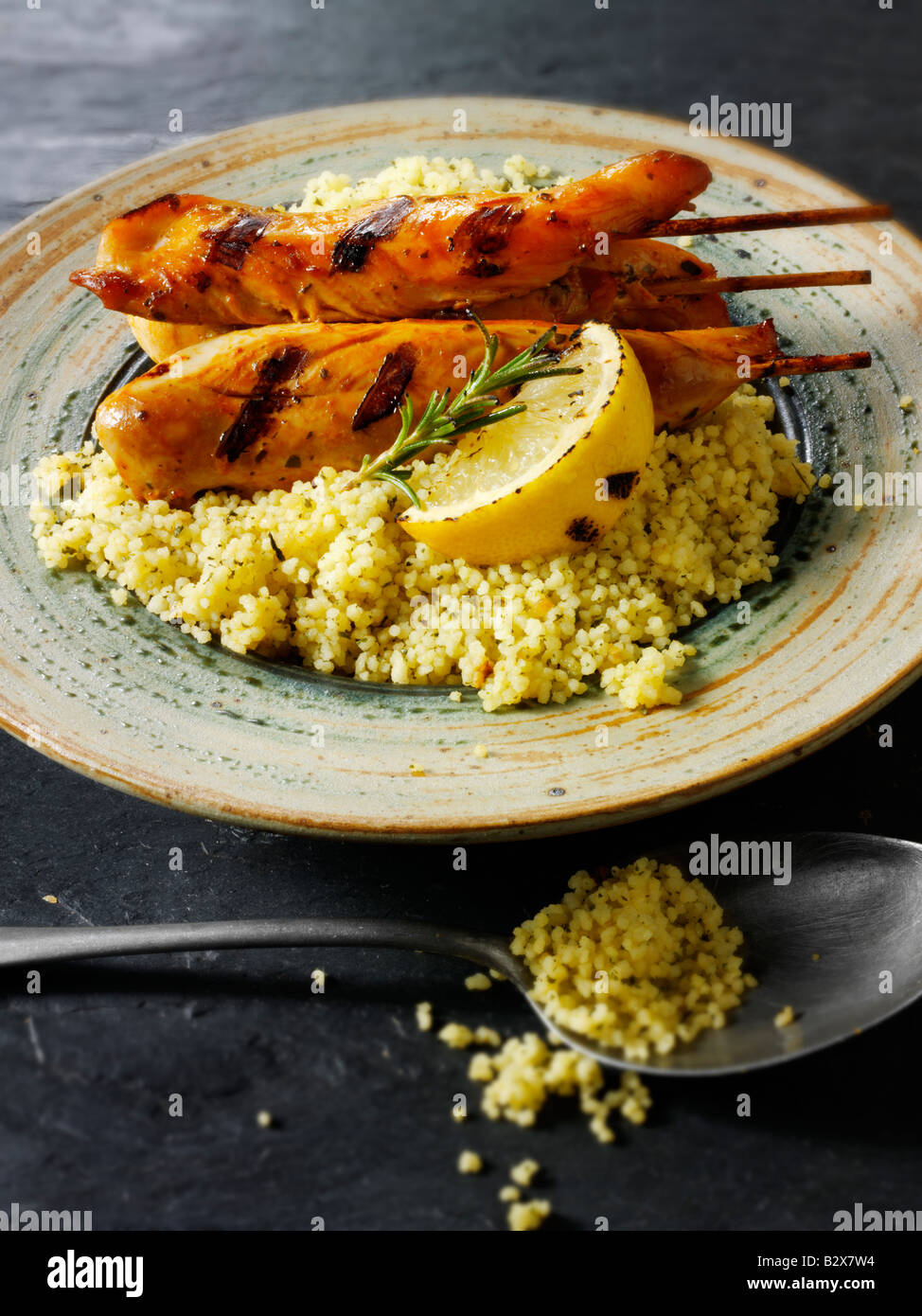 Marinaded chicken skewers on a bed of lemon and coriander couscous