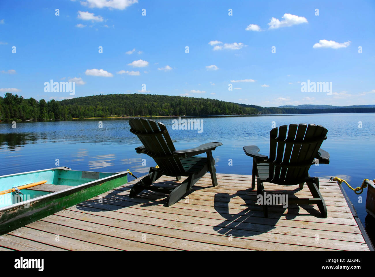 Two wooden chairs facing hi-res stock photography and images - Alamy
