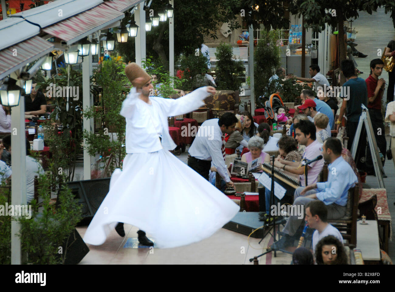 A Dervish dancer performing in a restaurant Stock Photo - Alamy