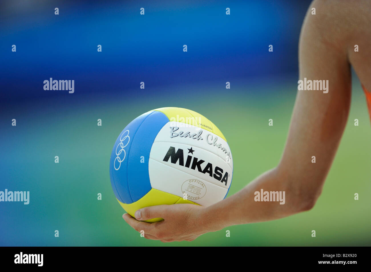 Female beach volley player ready to serve a Mikasa ball during the Beijing 2008 Olympic Games, China Stock Photo