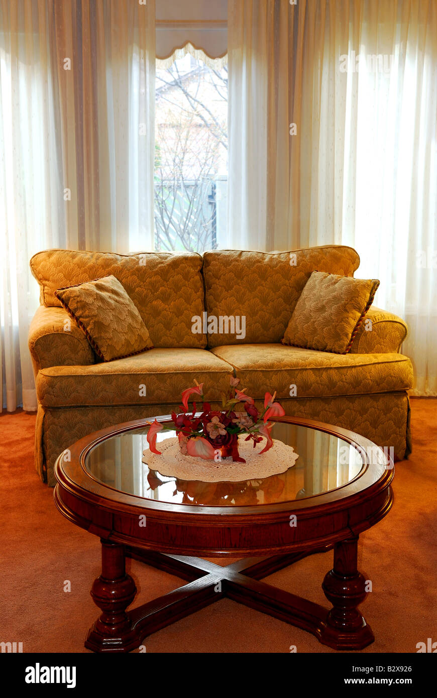 Interior of a cozy living room with sofa and coffee table Stock Photo ...