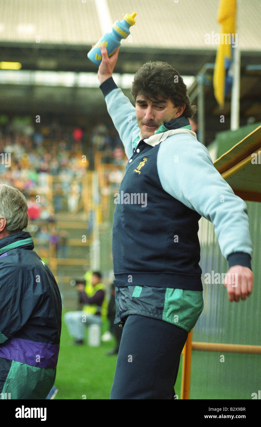 Angry football manager Ian Atkins throwing a plastic drink bottle Stock