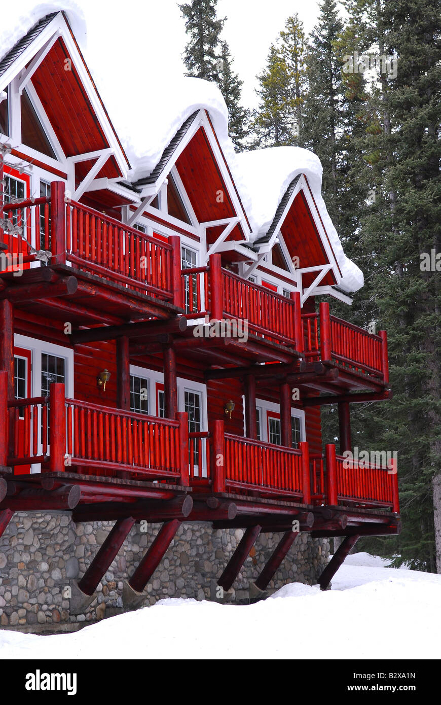 Log Building Of A Mountain Lodge In Winter At Ski Resort Stock