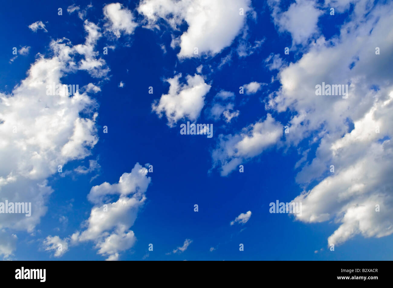 Background of blue sky with white cumulus clouds Stock Photo - Alamy
