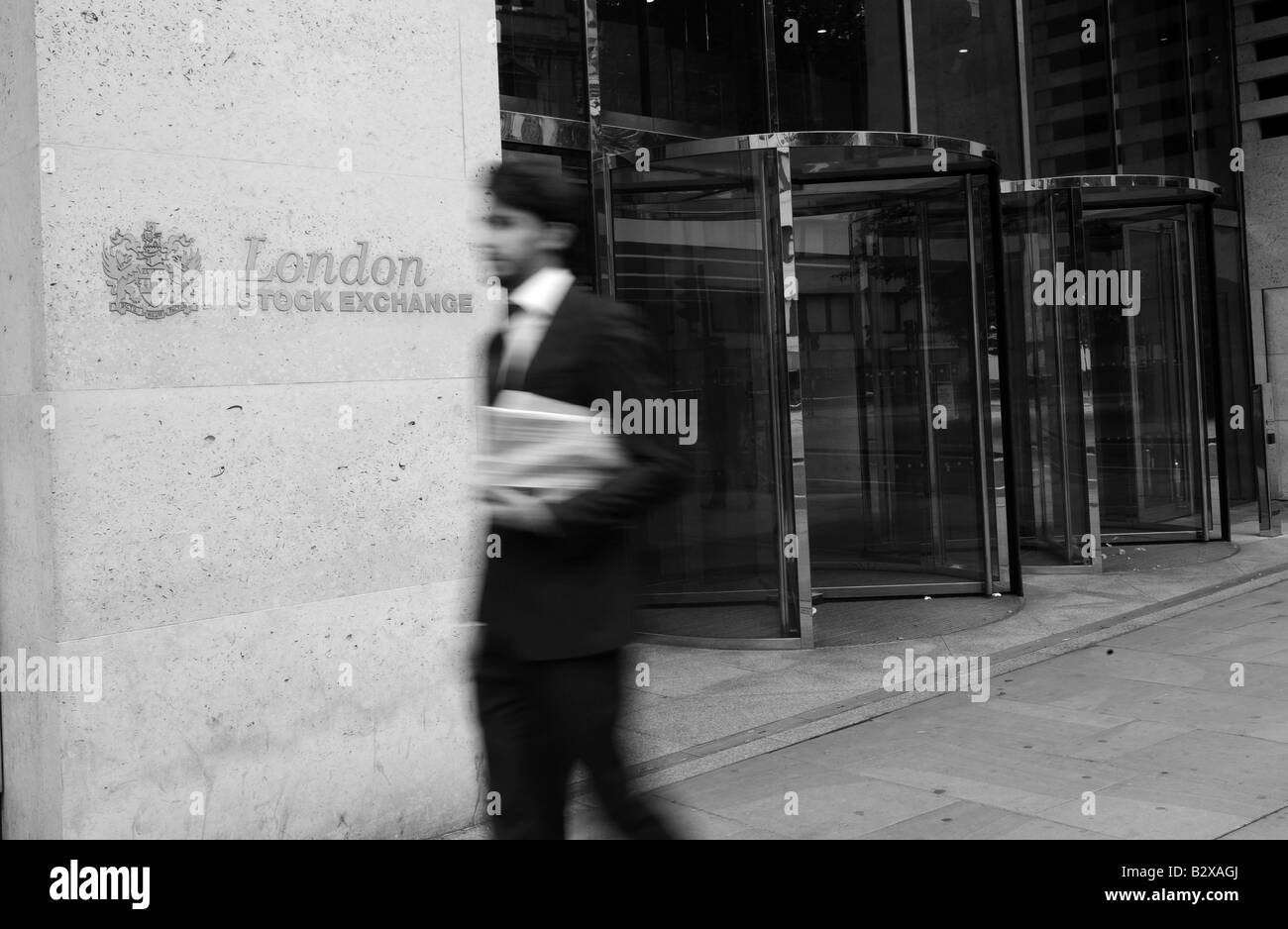 Business man walks past the London stock exchange Stock Photo