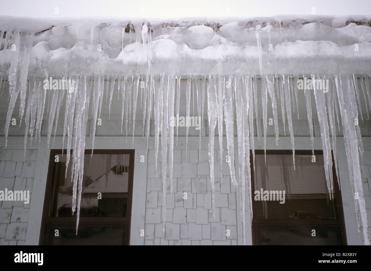 Icicles formed at drip edge of roof Stock Photo - Alamy