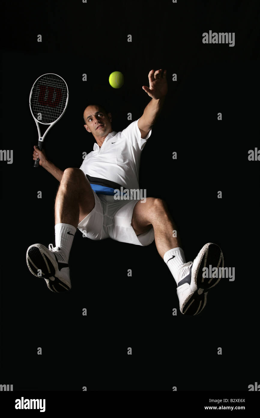 forty year old man playing tennis Stock Photo