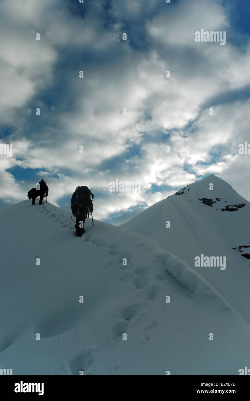 Climbers on the way to the second summit of Pequeno Alpamayo, part of Bolivia's Cordillera Real Stock Photo