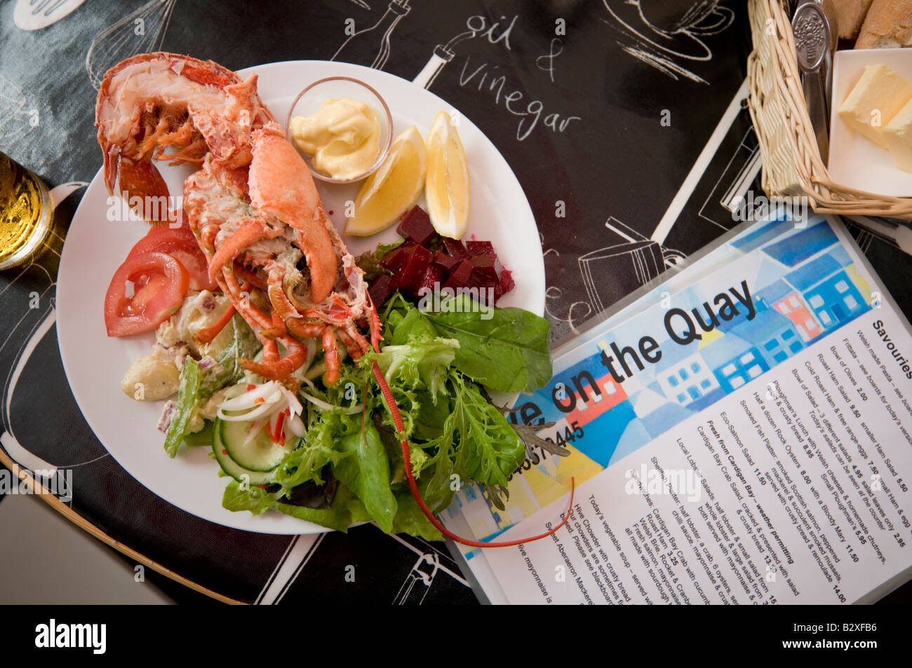Platter of cardigan bay fresh lobster salad in the Hive on the Quay seafood cafe bar restaurant Aberaeron Ceredigion Wales UK Stock Photo