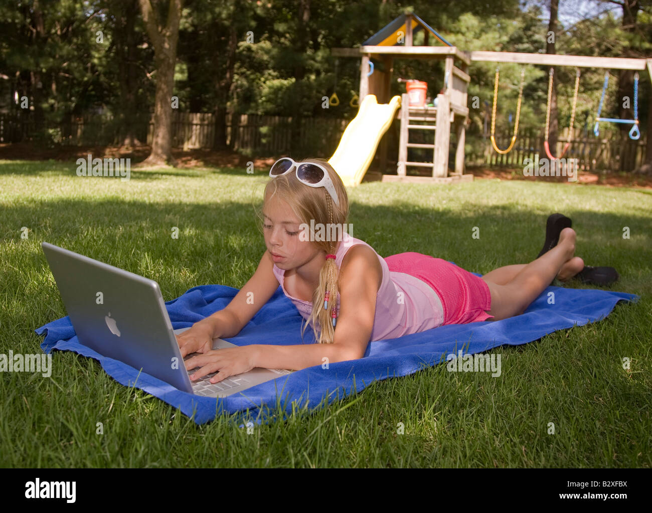 Young girl working on a laptop Stock Photo - Alamy