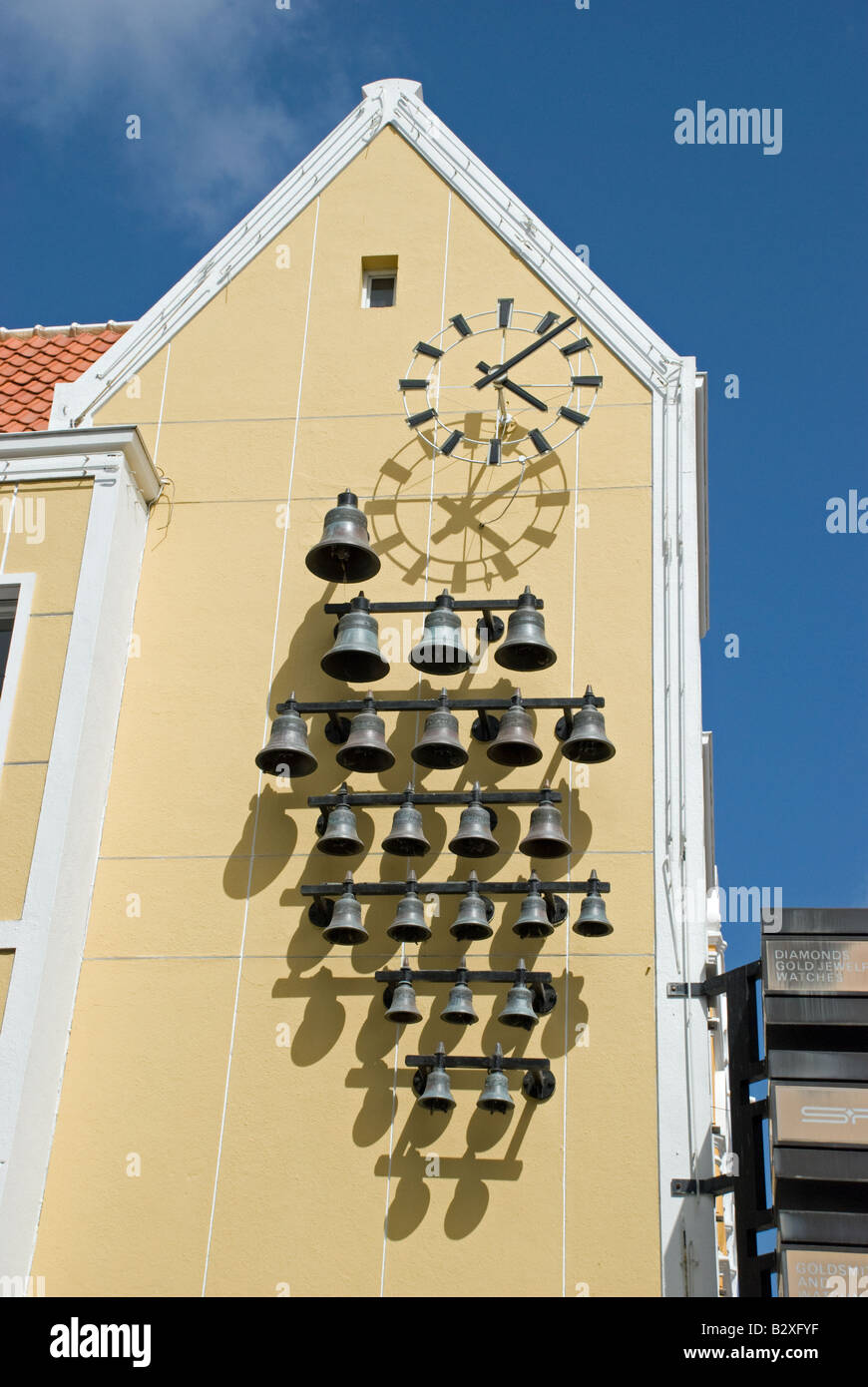 Wall clock with chiming bells. Willemstad, Curacao, Netherlands Antilles. Stock Photo