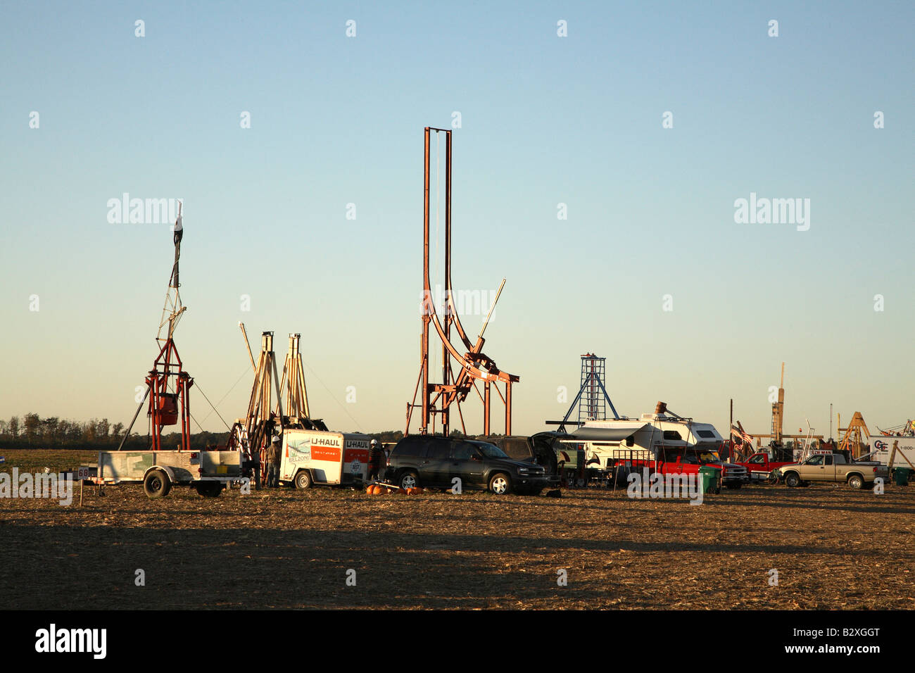 Line of trebuchets and catapult machines with support vehicles at the base. Stock Photo